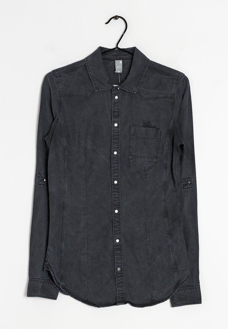 Camicia in denim nera a maniche lunghe con colletto classico, taschino frontale e chiusura a bottoni a pressione. Caratterizzata da un tessuto texturizzato e un orlo arrotondato.