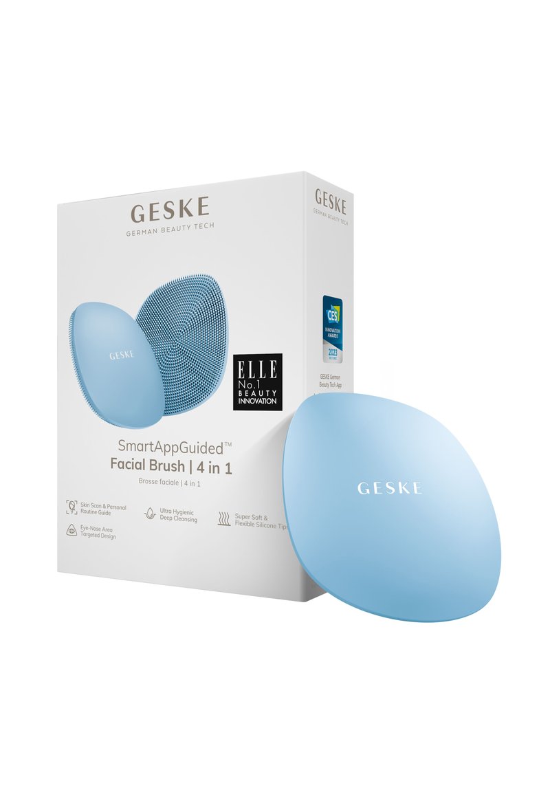 Brosse faciale en silicone bleu avec une forme ergonomique, surface texturée pour le nettoyage, et un emballage présentant les détails du produit et les logos.