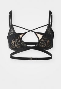 Black lace bra with a triangular design, featuring crisscrossed straps and a smooth underband. Contains sheer panels and floral patterns.