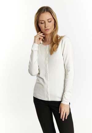 Witte lange mouwen cardigan met ronde halslijn en knoopsluiting aan de voorkant. Gemaakt van zachte stof, met een slim fit en geribbelde manchetten.