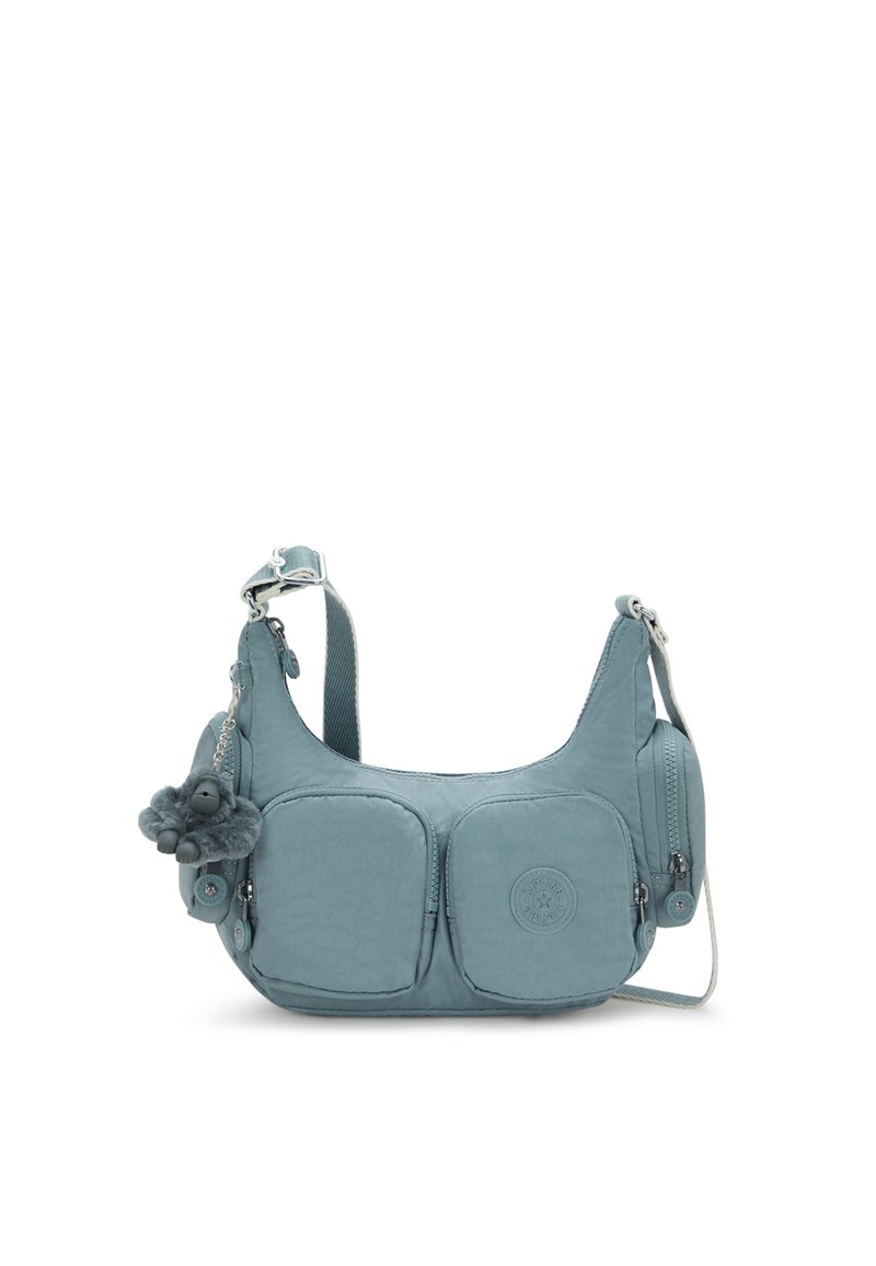 Blue crossbody bag with two front zip pockets, side zip compartment, adjustable strap, and small plush monkey keychain attached.