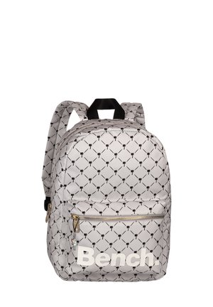 Backpack featuring a gray fabric with a black pattern of small shapes, a front zip pocket, and a large white logo on the lower front.