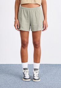 Nike Sportswear Calças de fato de treino - light army/sail