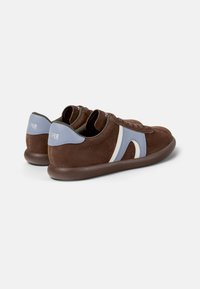 Brown suede sneakers with light blue and white accents, rounded toe, and a cushioned sole. Features laces and a textured finish.