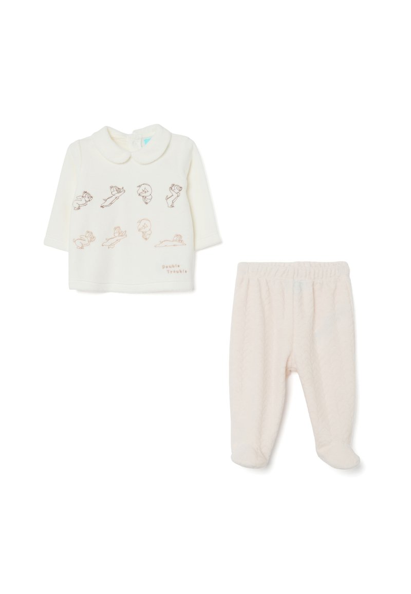 Crème lange mouwen top met speelse illustraties en een kraag, gecombineerd met lichtroze gevoerde broek met voetjes.