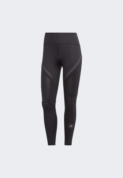 Zwarte sportleggings met een hoge tailleband, voorzien van matte en glanzende panelen, en decoratieve zilveren studs langs de zijnaad.