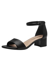 Schwarze Leder-Sandale mit offenem Zeh und breitem Riemen. Knöchelriemen mit einer Metall-Schnalle. Blockabsatz für Stabilität. Glatte Textur.