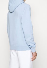 sandro Jersey con capucha - light blue