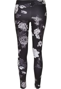 Svarta leggings med ett blommönster i vitt och grå nyanser. Stretchigt tyg med hög midja och figursydd silhuett.