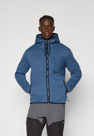 Blaues Kapuzenjacke mit strukturiertem Muster, Frontreißverschluss, seitlichen Taschen und Brusttasche. Hergestellt aus einem weichen, strapazierfähigen Stoff.