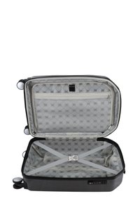Hard-shell suitcase in black with a textured exterior. Interior features a light-patterned lining, mesh pocket, and adjustable straps for securing items.