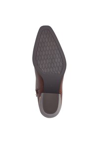 Semelle de chaussure en cuir marron avec un motif de grip en caoutchouc noir texturé. Présente un bout arrondi et un petit talon avec une finition lisse.