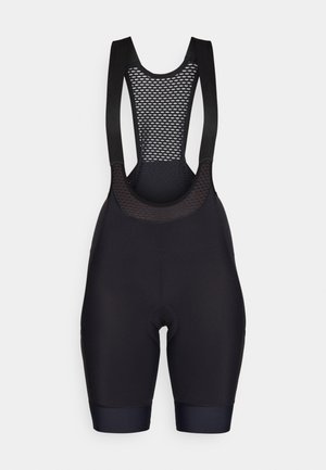 Svart sykkelbukse laget av elastisk stoff, med mesh rygg, polstret sete, og en tettsittende design med korte ben og elastiske mansjetter.