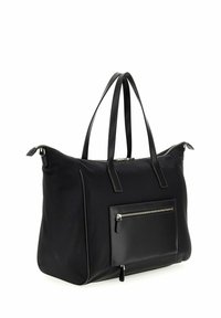 Zwarte grote tote bag met leren handvatten, voorkant met ritsvak en rits sluiting aan de bovenkant, weergegeven vanuit een lichte hoek op een witte achtergrond.