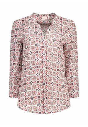 Blouse à manches longues boutonnée avec motif géométrique et floral rose, beige et marron sur fond blanc.