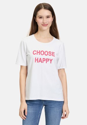 T-shirt en coton blanc avec le texte "CHOISIS L'ENJOUEMENT" en sequins roses. Coupe régulière avec des manches courtes, encolure ronde et texture douce.
