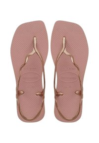 Infradito rosa in gomma con cinturini metallici color oro rosa. La suola testurizzata presenta il nome del marchio e i dettagli sulla taglia impressi.