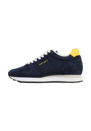 Scarpa da ginnastica blu navy con lacci bianchi, suola bianca e battitacco giallo, con il marchio "Teddy Smith" sul lato.