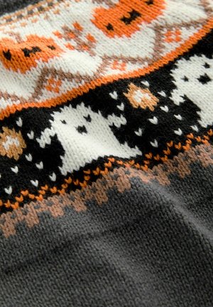 Knit sweater fabric featuring a black base with orange and white ghost and pumpkin patterns, textured with a soft, warm finish.