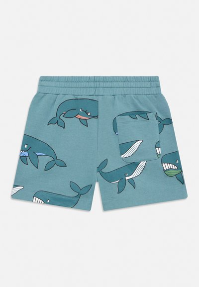 Kék rugalmas derékrészű rövidnadrágok, rajzfilm bálna mintákkal és egy kis zsebbel a hátul jobb oldalon.