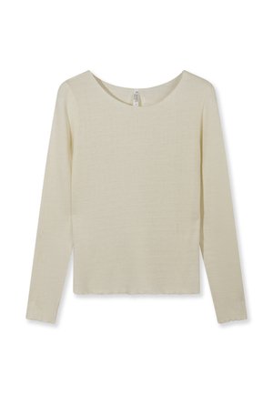 Chemise à manches longues en tricot côtelé de couleur crème avec encolure ronde et ourlets et poignets légèrement festonnés, posée à plat sur un fond blanc.