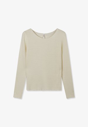 Chemise à manches longues en tricot côtelé de couleur crème avec encolure ronde et ourlets et poignets légèrement festonnés, posée à plat sur un fond blanc.