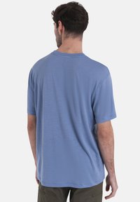 icebreaker POCKE TE - T-Shirt sport - LIGHT BLUE