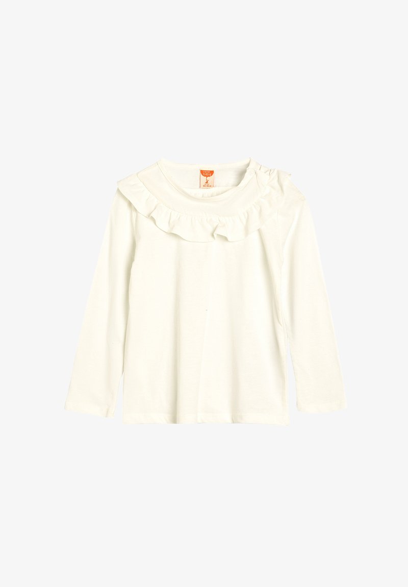 Langärmliges weißes Baumwolloberteil mit einem runden Halsausschnitt und einem Rüschensaum sowie seitlichem Druckknopfverschluss. Sanfte Textur, lockerer Schnitt.
