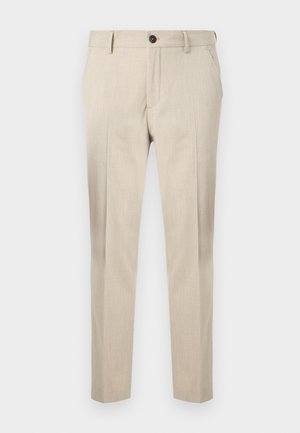 Beige, smale dressbukser med lommer foran, beltehemper og knappelukking, vist mot en ensfarget hvit bakgrunn.