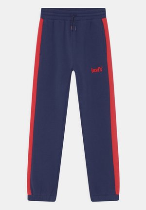 Marineblaue Jogginghose mit roten Seitenstreifen, elastischem Bund, Kordelzug und kleinem, eingesticktem Levi's-Logo am oberen linken Bein.