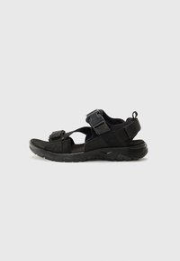 Black sport sandals with adjustable straps, textured footbed, and sturdy outsole. Lightweight design suitable for outdoor activities.