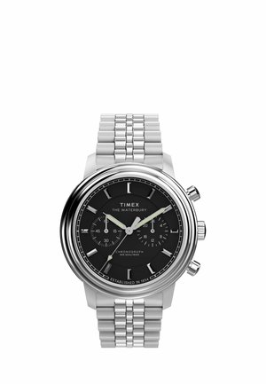 Silver metal Timex Waterbury chronograph watch with black dial, three hands, subdials, and link bracelet band.