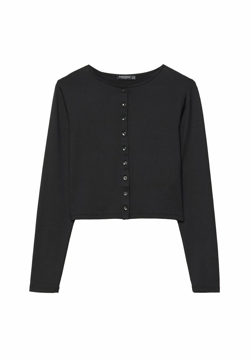 Haut court noir à manches longues avec un col rond, présentant une fermeture boutonnée à l'avant et une texture de tissu lisse et douce.