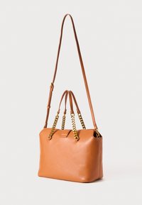 Tan leather handbag with dual gold chain and leather handles, adjustable long shoulder strap, against a plain light background.