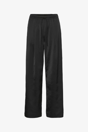 Black wide-leg pants made of smooth, shiny fabric. Features an elastic waistband with a drawstring for adjustable fit.