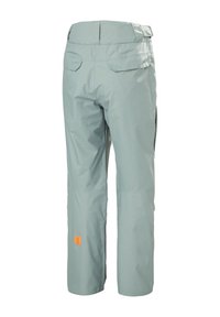 Lichtgroene waterdichte broek met een ontspannen pasvorm, twee achterzakken en een oranje logo patch. Soepele textuur met naaddetail.