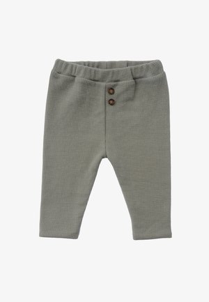 Grüne, waffelstrukturierte Hose mit einem elastischen Bund und zwei braunen Knöpfen an der Vorderseite. Mit konischem Bein design.