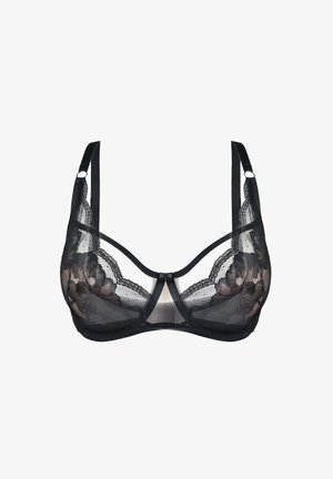 Czarna koronkowa biustonosz z przezroczystymi panelami, ozdobami w kwiatowy wzór, regulowanymi ramiączkami i centralną kokardką. Miękka tekstura i wsparcie w postaci fiszbiny.