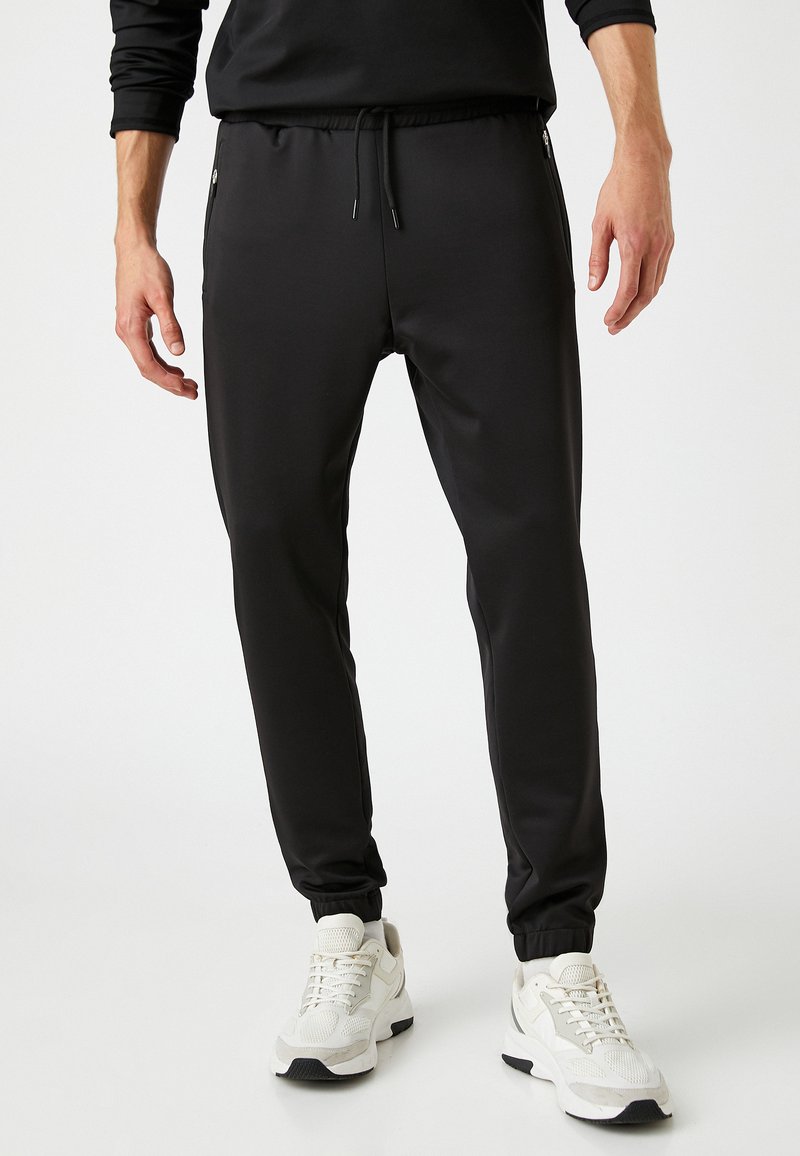 Koton BASIC DRAWSTRING Tracksuit bottoms black Zalando.de