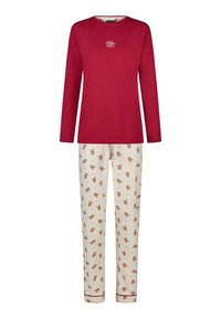 Czerwona bluzka z długim rękawem z nadrukiem "Rolly Jolly" na piersi; kremowe spodnie z motywem piernikowych ludzików, elastycznym pasem i czerwonymi wykończeniami.