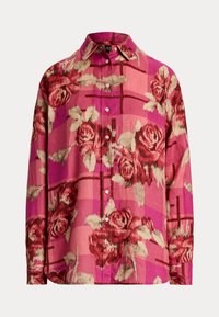Button-up shirt in pink with a floral pattern featuring roses, textured fabric, and long sleeves. Collared with a slightly loose fit.