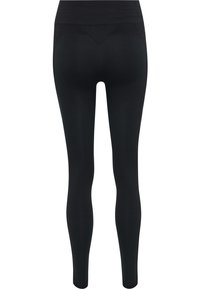 Leggings neri a vita alta senza cuciture con dettagli testurizzati sulla fascia, sulla parte alta delle cosce e sui polpacci, mostrati da dietro.