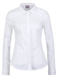Vit knäppskjorta med långa ärmar, klassisk krage och rundad nederkant. Tillverkad av mjuk bomull med en fräsch och ren finish.