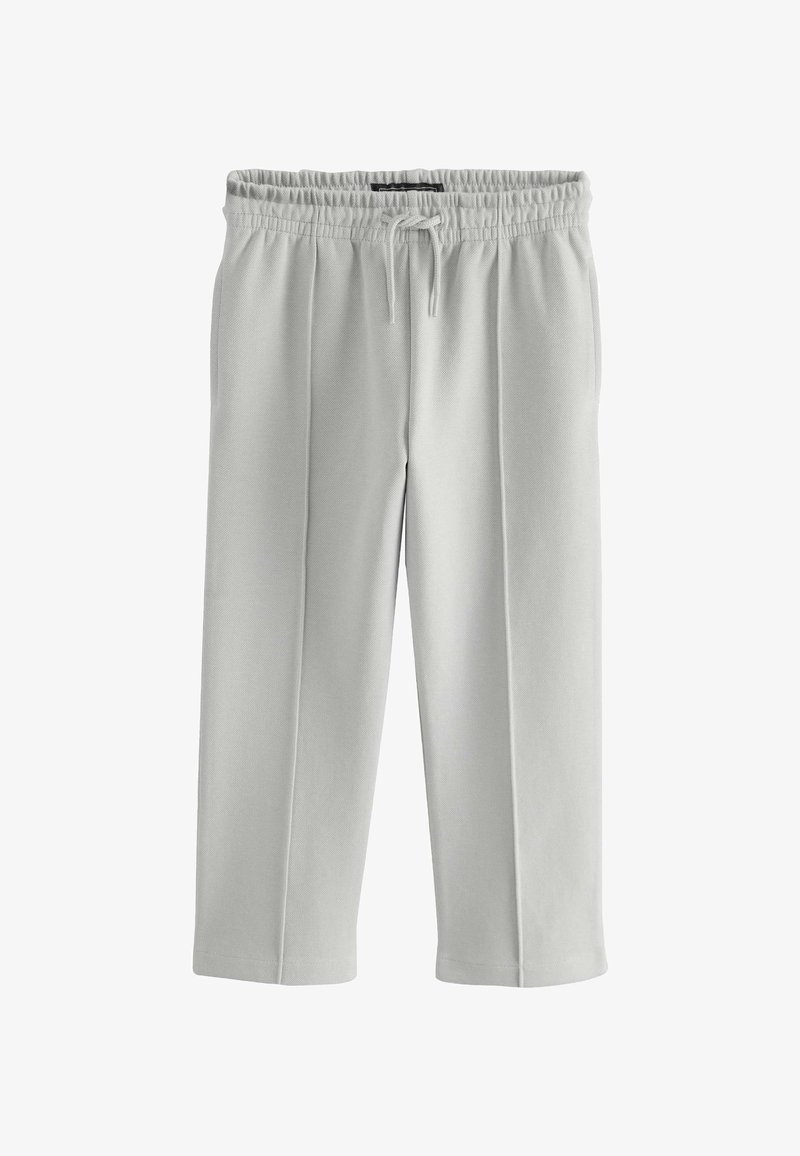 Pantaloni felpati di lunghezza media di colore grigio chiaro, con una vita elastica, cordoncino e cuciture laterali per una vestibilità comoda. Tessuto morbido.