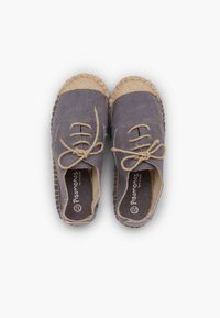 Gray canvas shoes with jute accents, round toe, lace-up design, and textured sole. Interior features logo and cushioned footbed.