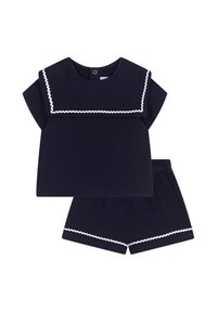 Completo due pezzi blu navy con una maglietta a maniche corte caratterizzata da un colletto bianco a onde e pantaloni corti con vita elastica abbinati. Tessuto testurizzato.