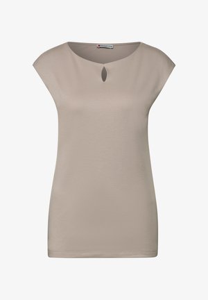 Haut beige à manches courtes avec un col rond et un détail en forme de trou de serrure. Tissu lisse, coupe droite et éléments de design minimalistes.