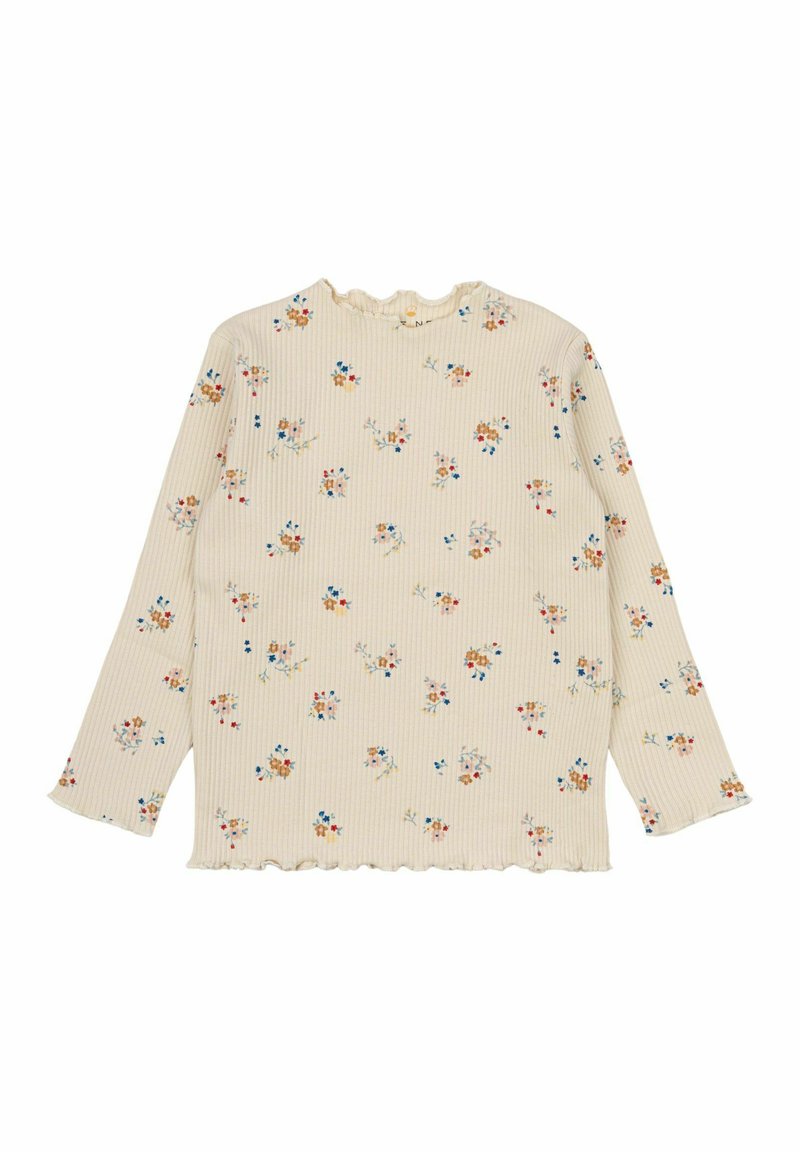 Top lungo a maniche con texture a coste color crema, caratterizzato da motivi floreali in blu, arancione e rosso. Dettagli scallop sul collo e sull'orlo.