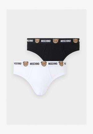 Kaksi miesten alushousua, yksi musta ja yksi valkoinen, molemmissa vyötäröllä toistuva "Moschino"-teksti ja nallejen kasvot.