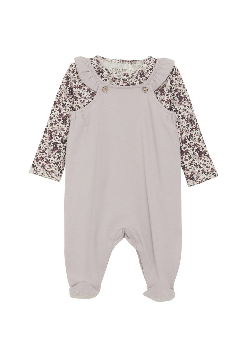 Lys lavendelfarvet overall med en langærmet skjorte med blomsterprint. Har flæser ved halsudskæringen og træknapper på skulderen. Blødt stof.